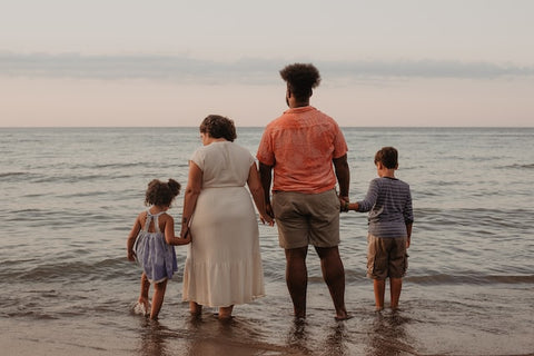 family of four by the beach