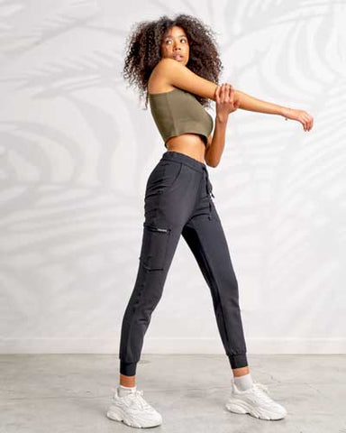 Women stretching in an Eco-friendly jogger and crop top outfit