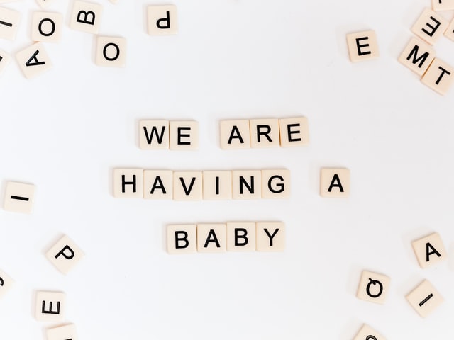 We are having an eco-friendly baby spelt with scrabble tiles