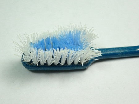 old used toothbrush with worn out bristles