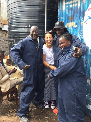 friends hugging artisan partenrs in Kenya Africa