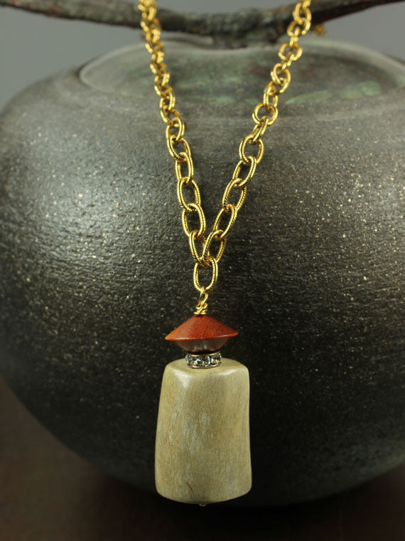 Horn, wood and crystal pendant necklace