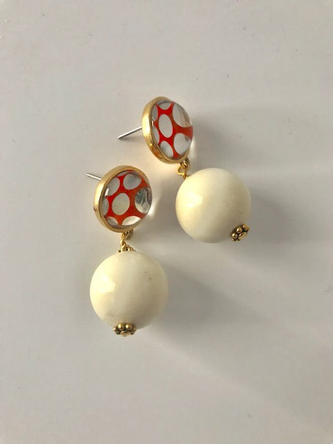 Orange dotted white lucite earrings