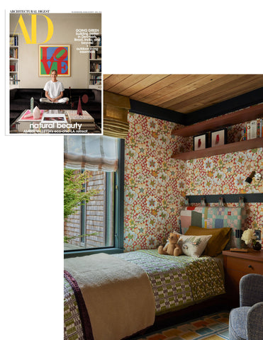 Image of kid's room featured in Architectural Digest, Coral & Tusk Stargazers pocket pillow acts as the focal point on the bed with gorgeous quilted headboard by Adam Pogue and colorful wallpaper by Josef Frank for Svenskt Tenn.