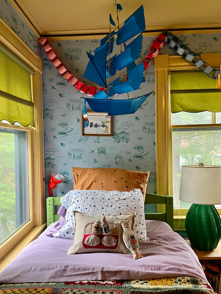 Audrey leary children's room with Coral & Tusk pillow and pocket doll wes anderson
