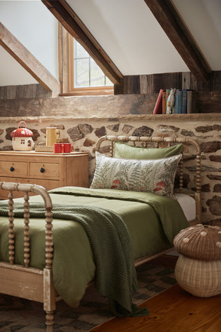 Coral and Tusk pillow on twin bed in cottage core room