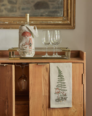 Bar cart with Coral & Tusk Mushrooms and Ferns wine bag and fern tea towels