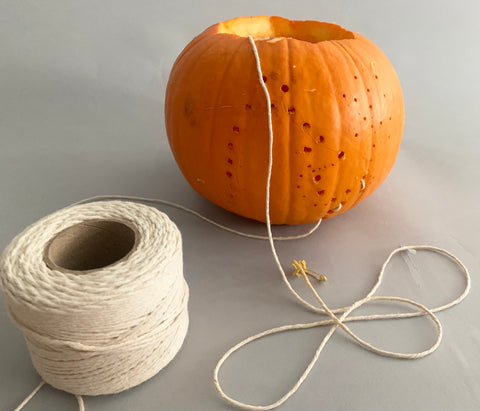 Pumpkin drill holes Coral & Tusk Halloween Project twine