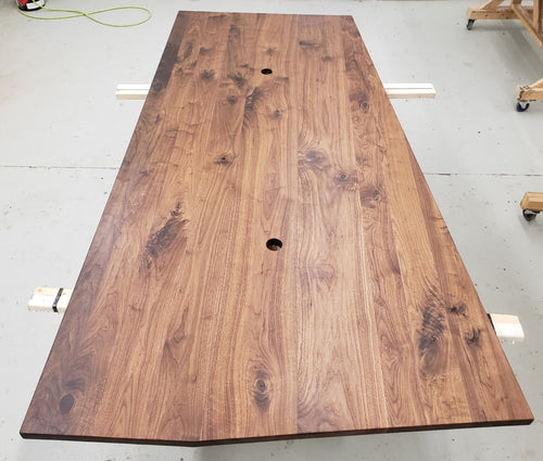 A walnut custom table top in the shop.