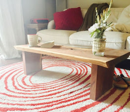 A bright live edge furniture piece in a living room