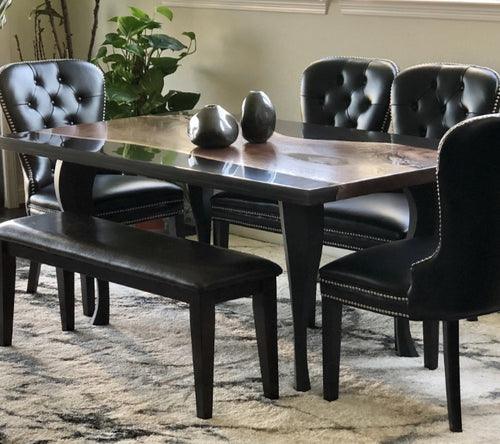 Live Edge Dining table in a dining home with 4 black chairs