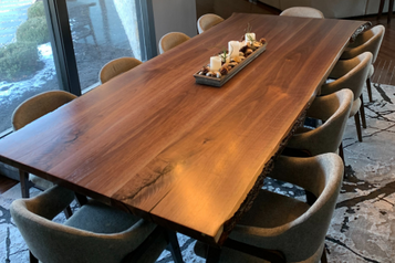 Walnut wood table with gray chairs
