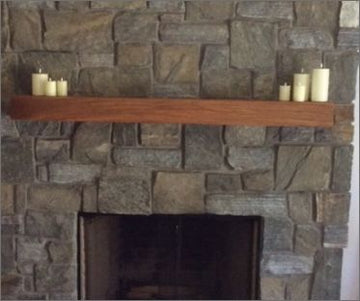 thick-live-edge-mantel-against-brick-fireplace