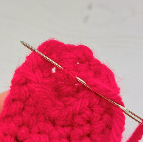 10.	Sew a couple of small stitches into the back of your work, then cut the strand at it's base