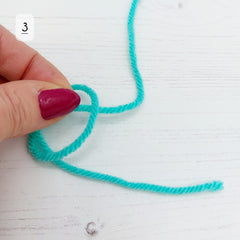 Pull the yarn from behind the loop, though the loop.