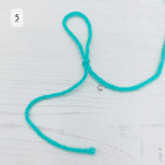 Gently pull it to form a slip knot.