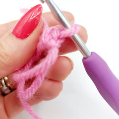 You have now completed your first Double Crochet (DC) stitch!  It looks like a small V shape, as you can see below.