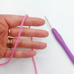 How to Crochet a Magic Circle - Step 1. Wrap the end of the yarn over the back of your dominant hand