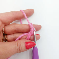 Step 6.  Pull the hooked strand through the loop which is on your hook. 