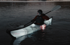 man kayaking on his coast xt kayak model with led lights on the water