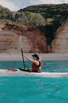 gif of woman kayaking on her coast xt kayak on water 