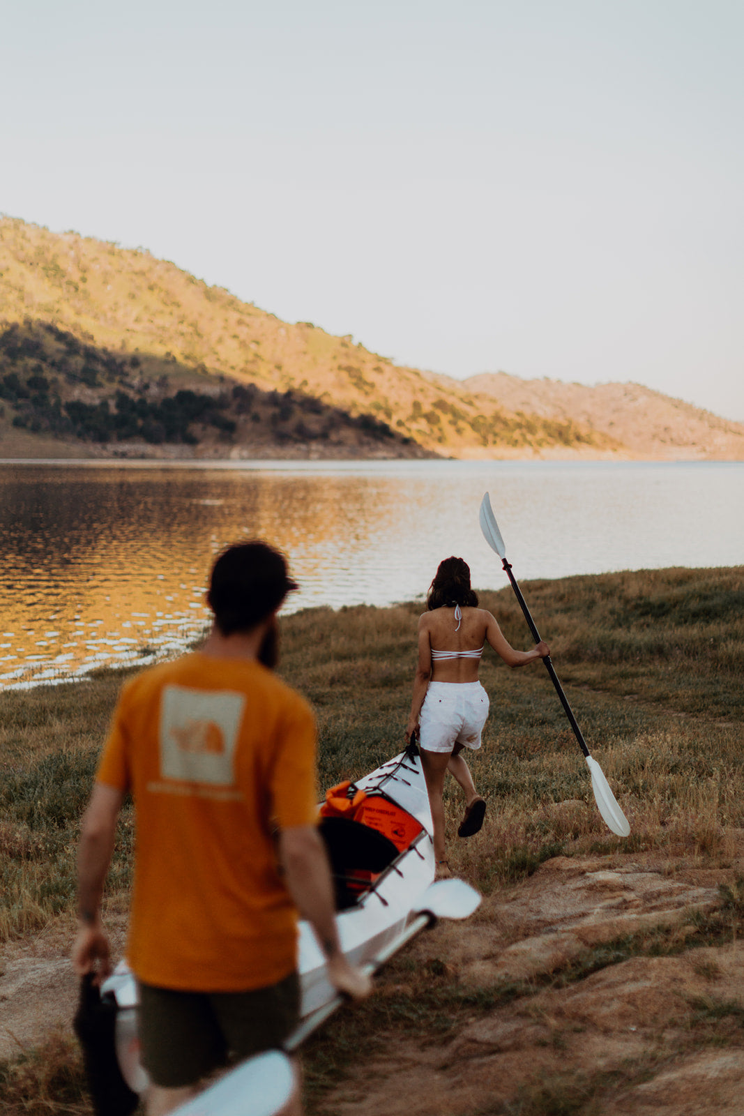 people by the river with their haven tt kayak