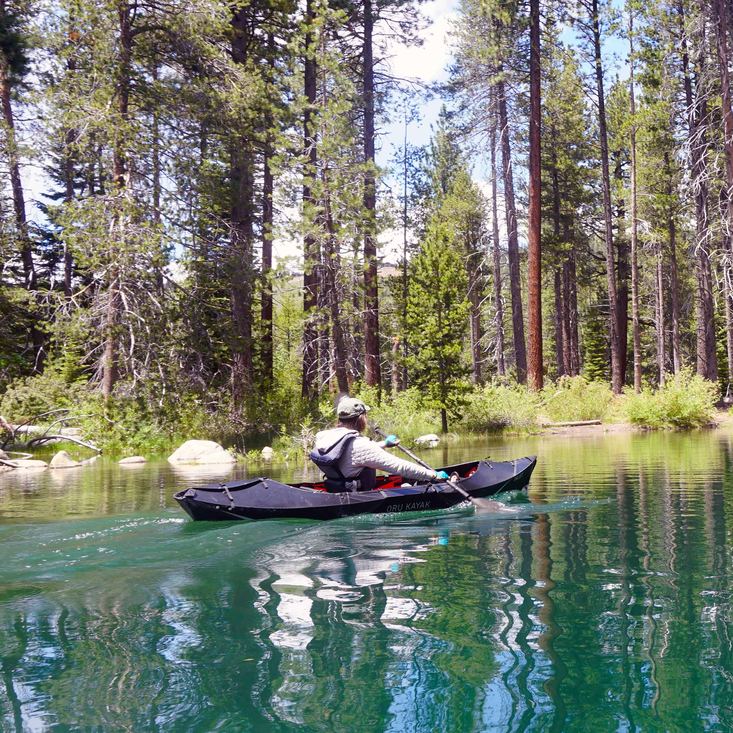 Woman kayaking on her inlet black editionkayak