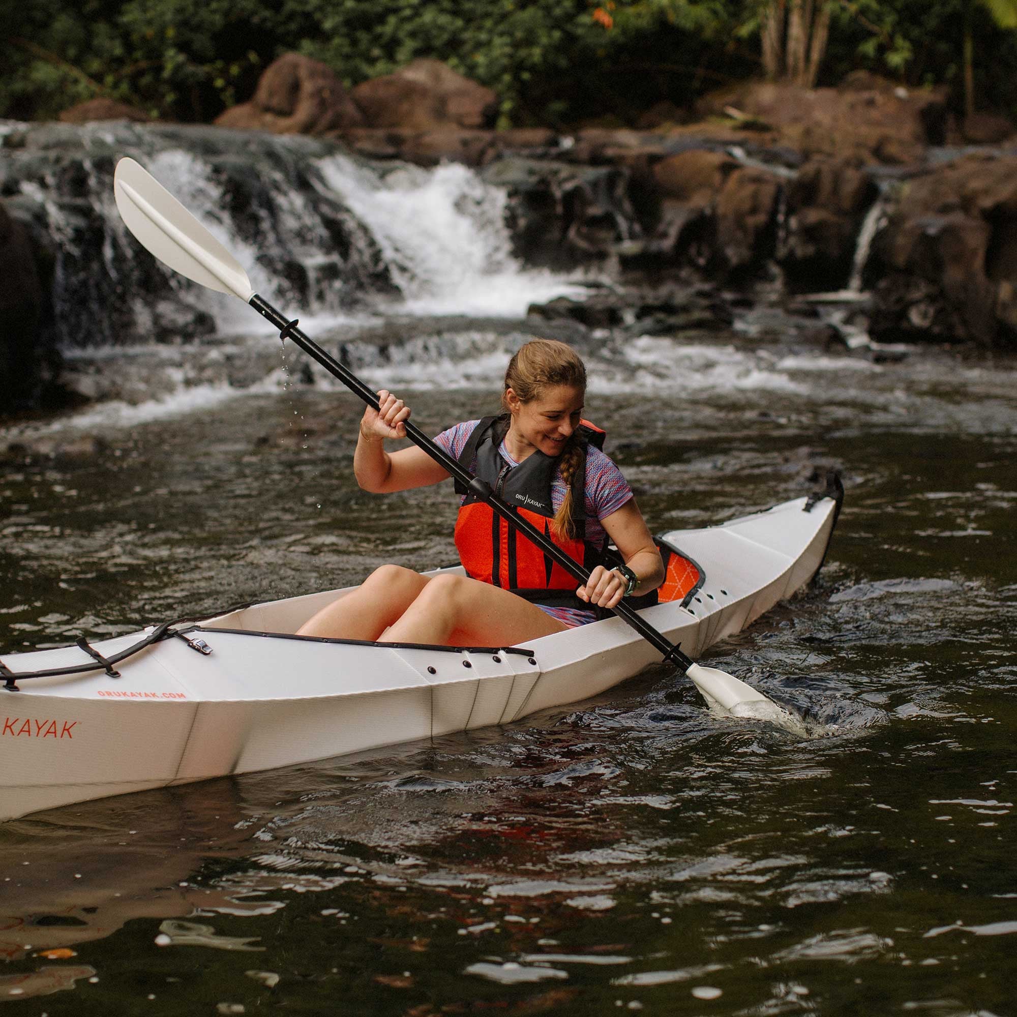 woman paddling on her beach lt kayak 