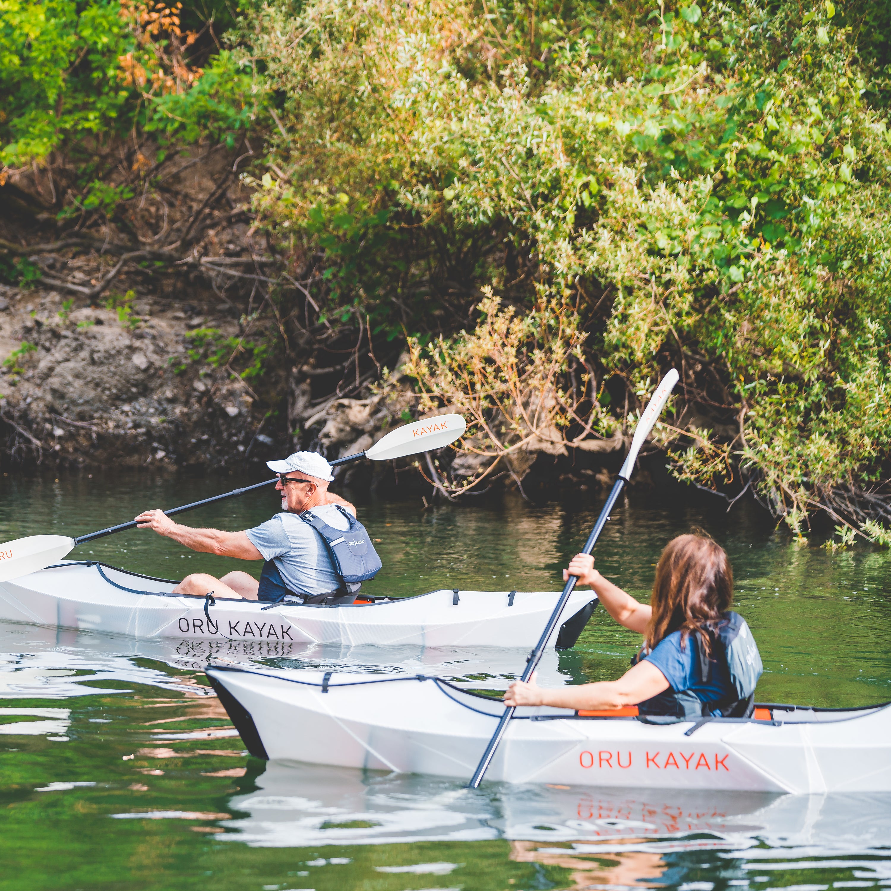 Two people kayaking on their inlet kayaks