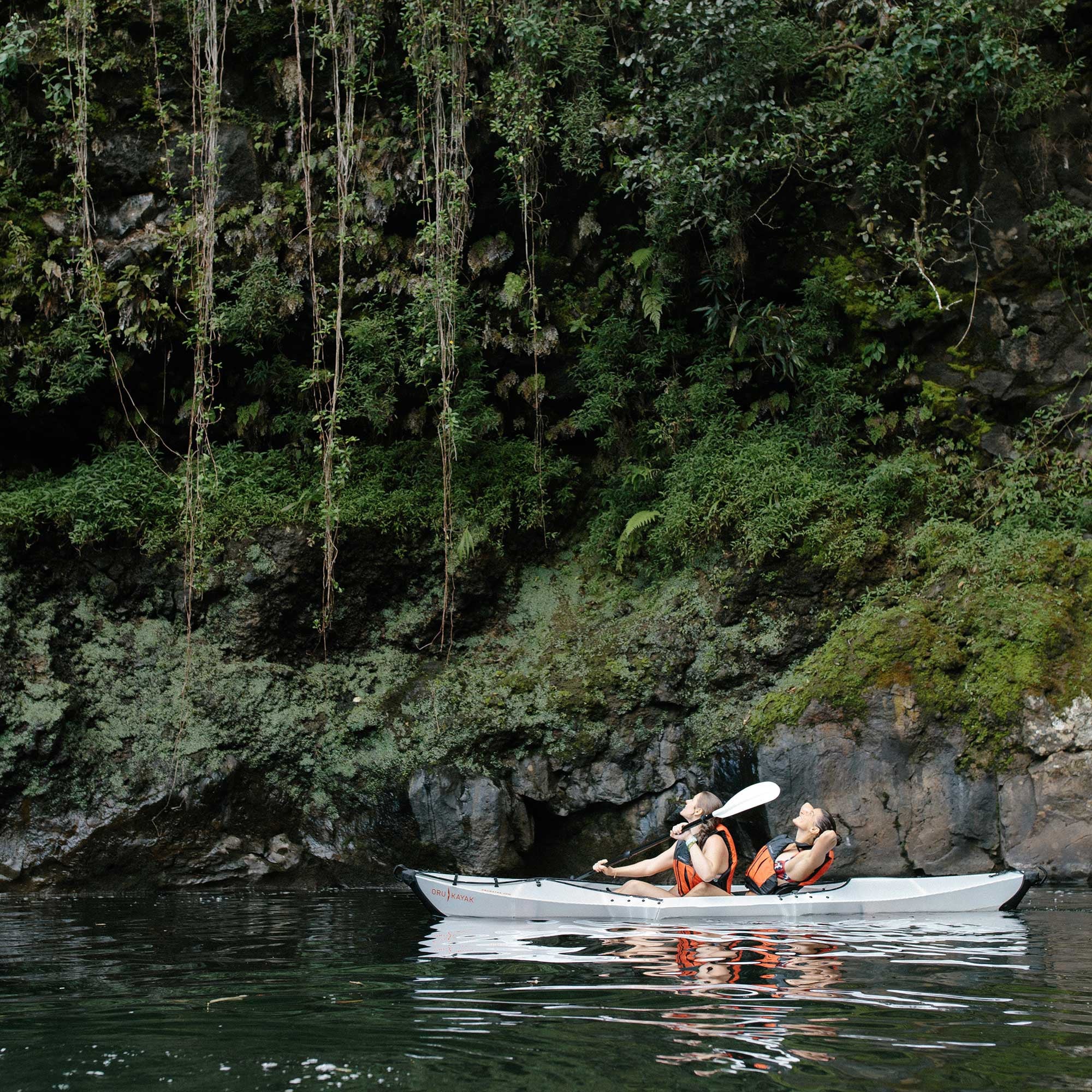 people paddling on their beach lt kayak