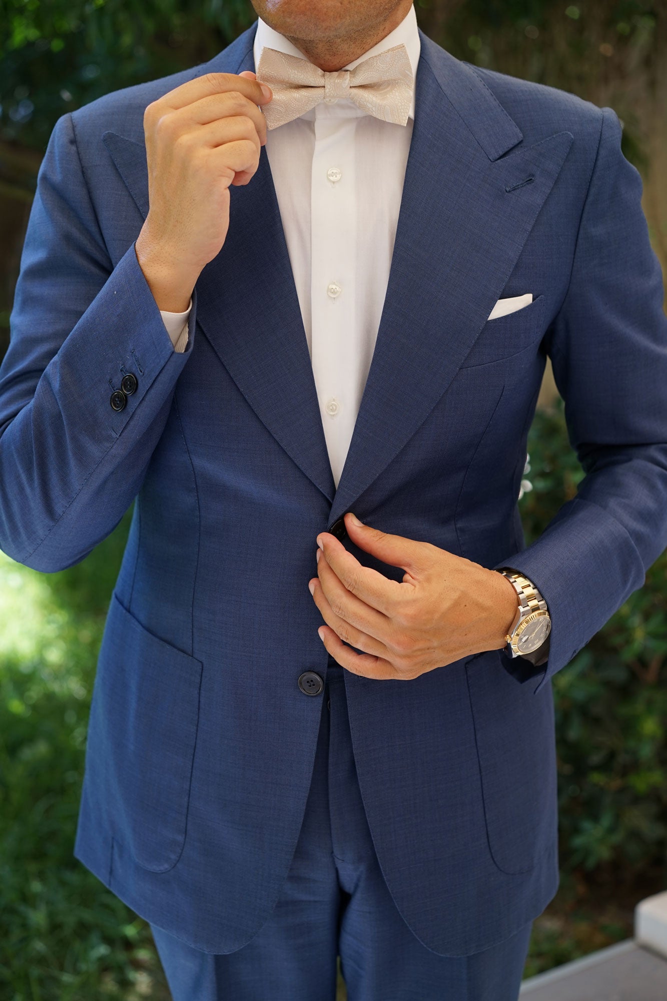 navy blue suit with champagne bow tie