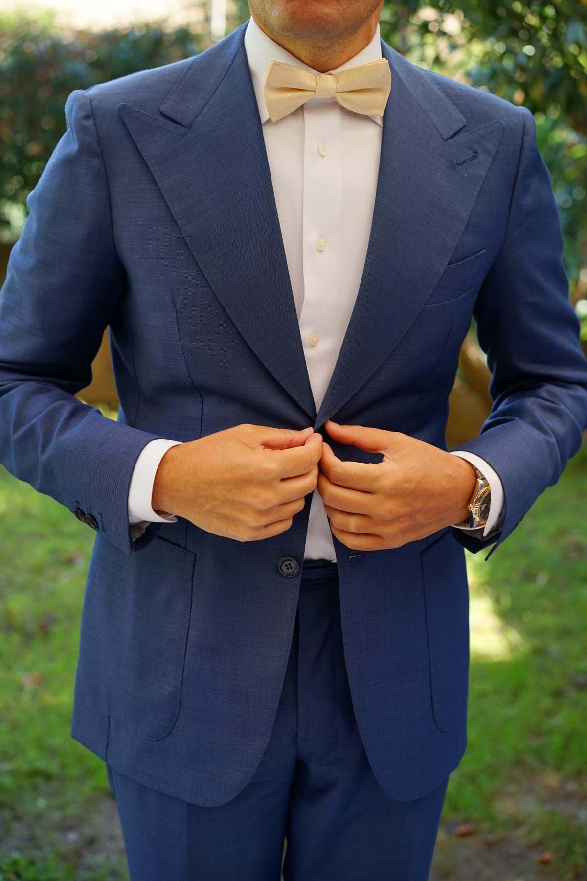 navy blue suit with champagne bow tie