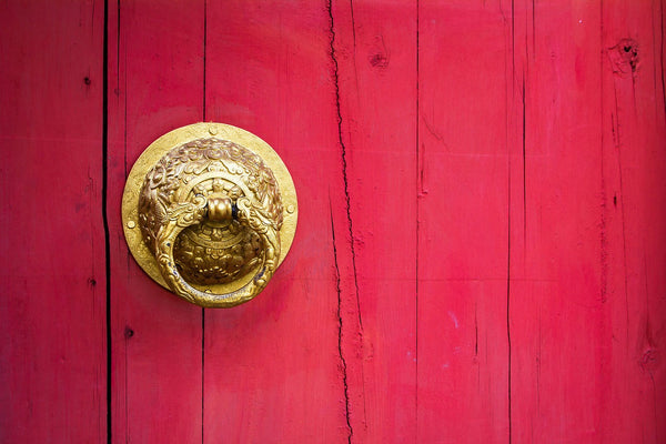 door knocker on red front door 