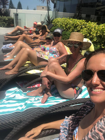 Ladies lounging by the pool at Peppers Broadbeach