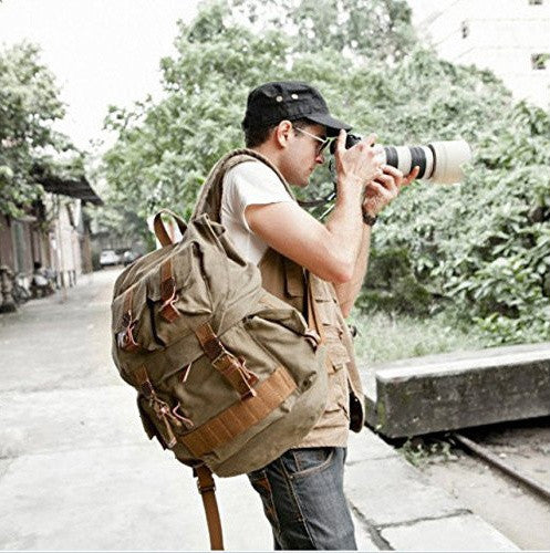 Stylish mean wearing the army green canvas hiking school rucksack by Serbags