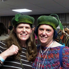 Two sisters modeling two similarly designed felted hats - the Green Leaf Caps - at the PGH Knit and Crochet Festival.