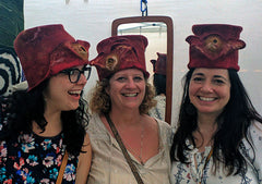 Two hats are more fun than one. Here are three Red and Yellow Felted Hats being worn by three visitors to the Three Rivers Arts Festival last year.