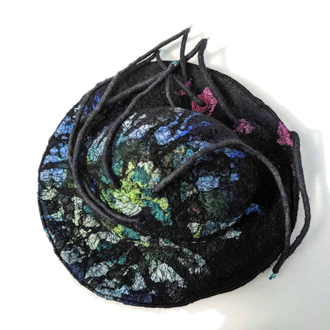 Top view of brimmed hat inspired by Harry Clarke's stained glass.