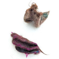 Two 3D samples of human hair felted with sheep wool