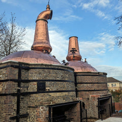 Two copper and brick stills on the NCAD campus