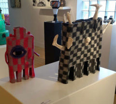 Two of Rae Gold's Felted Teapots on exhibition