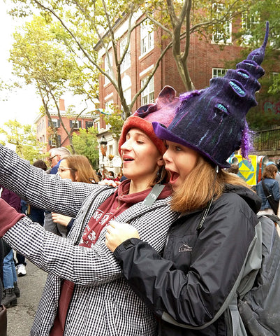 Two young women enjoying some of my felted wizard hats at RISDCraft