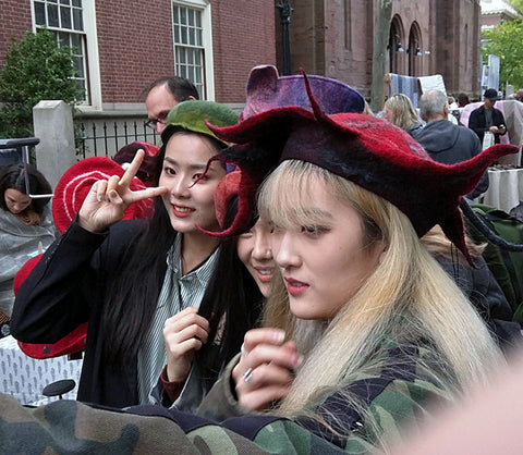 Three young women being Happy in FeltHappiness Hats.