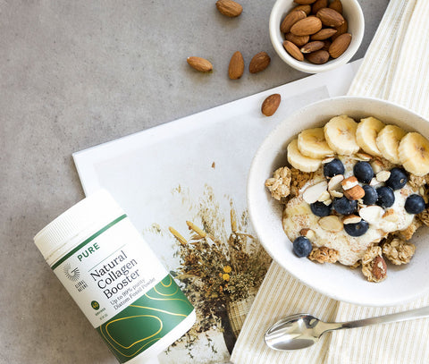 silica supplement powder with a bowl of almonds, bananas and blueberries
