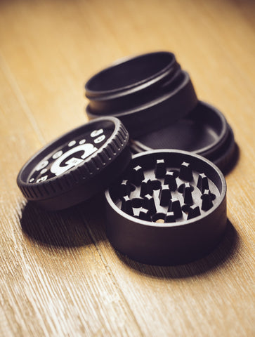 4 piece herb grinder on table