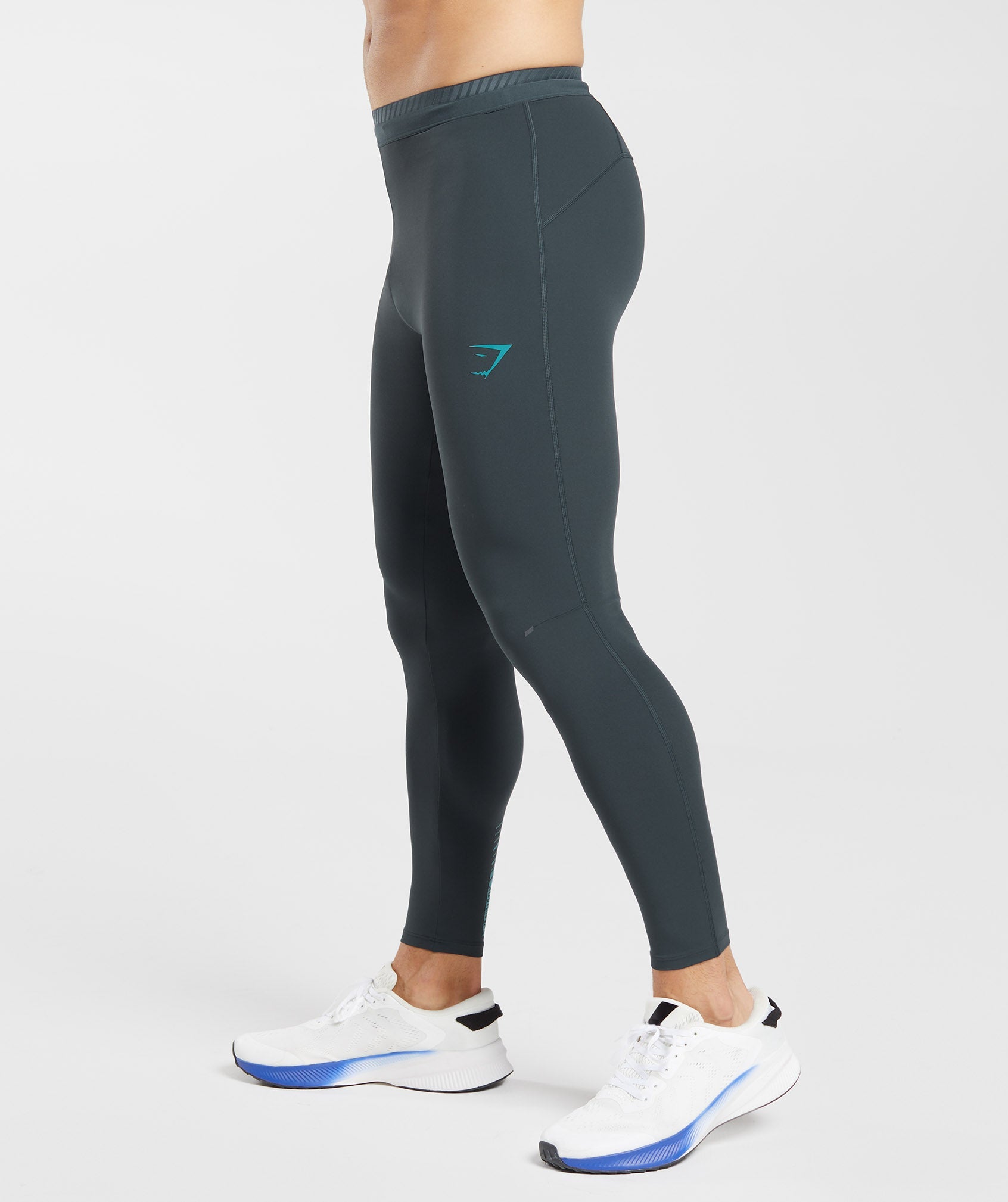 Apex Run Tights in Darkest Teal - view 3