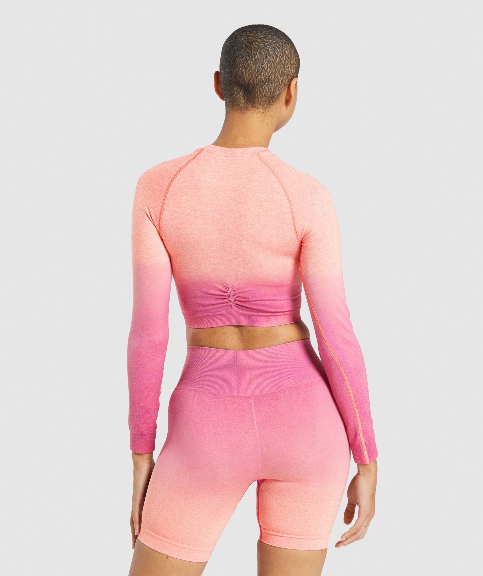 Adapt Ombre Seamless Long Sleeve Crop Top in Orange Marl/Pink