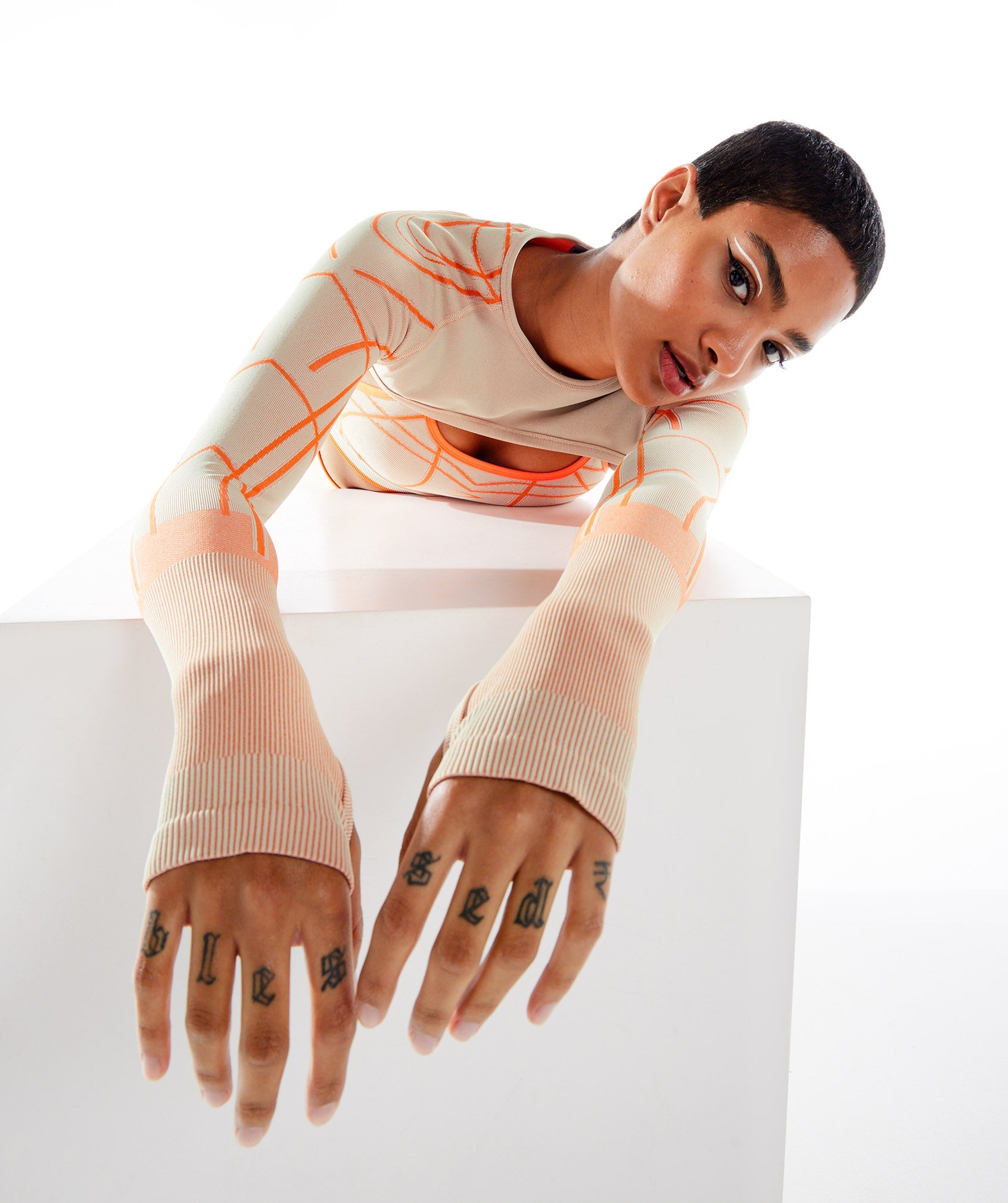 Wtflex Linear Seamless Long Sleeve Shrug in Pebble Grey/Orange/Coconut White