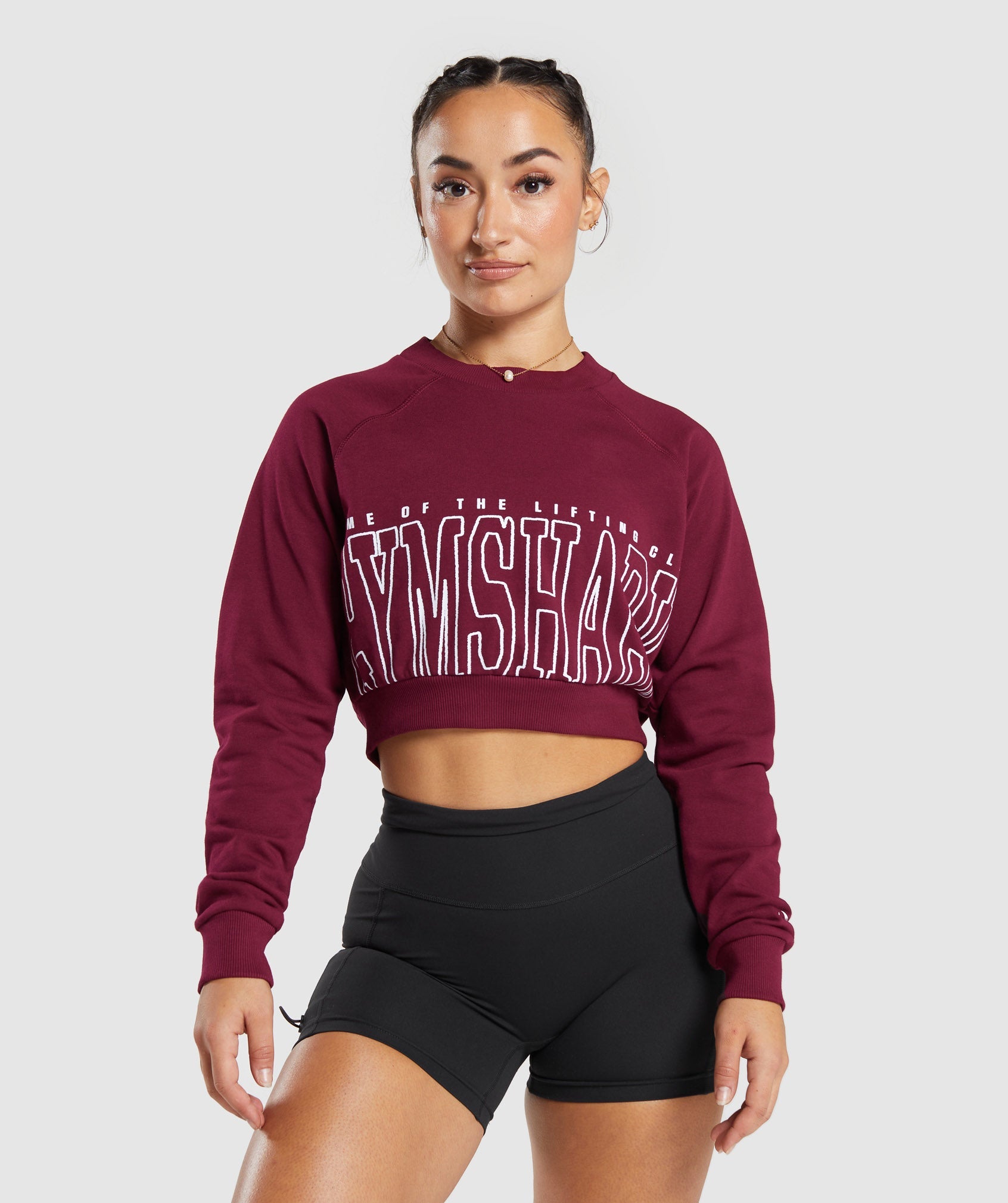 Lifting Graphic Cropped Sweatshirt in Plum Pink - view 1