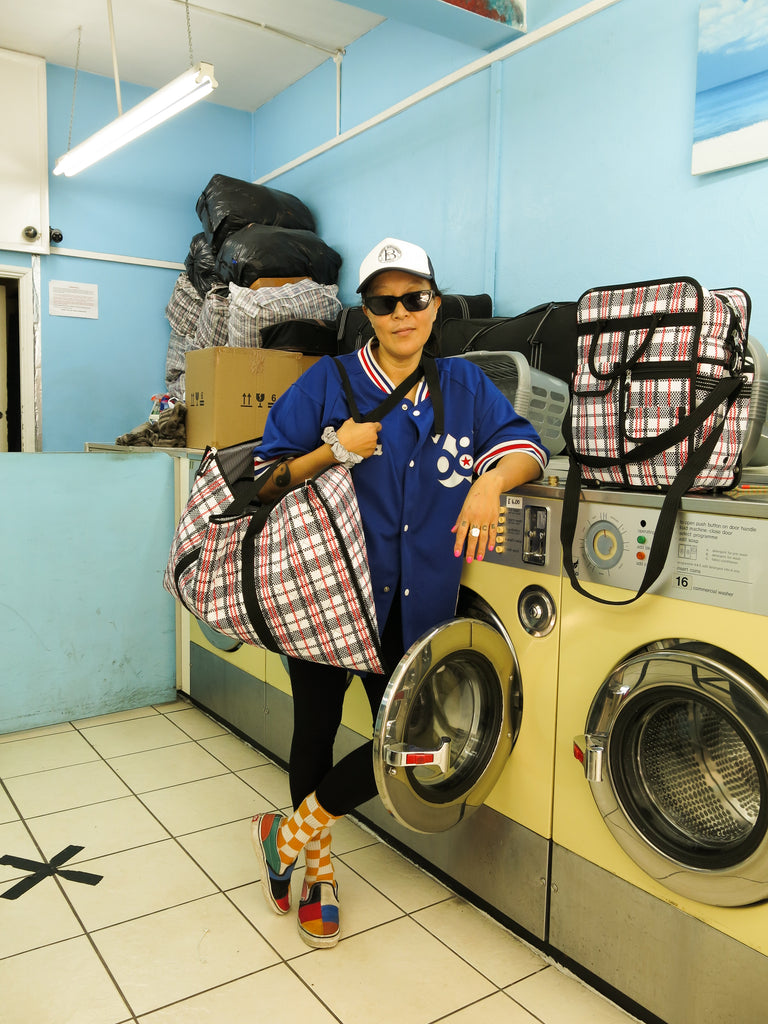 Goodordering laundrette photo shoot with tartan bag range